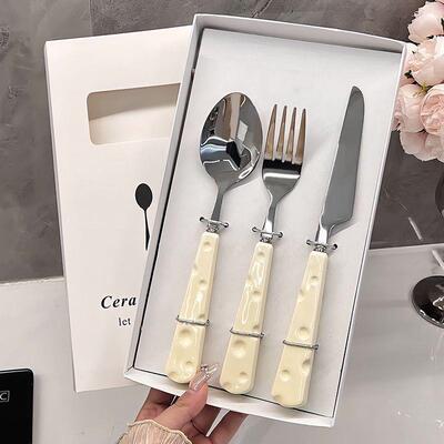 A sweet spoon for an unspoiled steel steak knife and fork fo