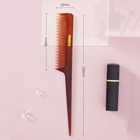 maggie's pointed-tail comb, with two layers of teeth, is used to brush and style the hair thumbnail 2