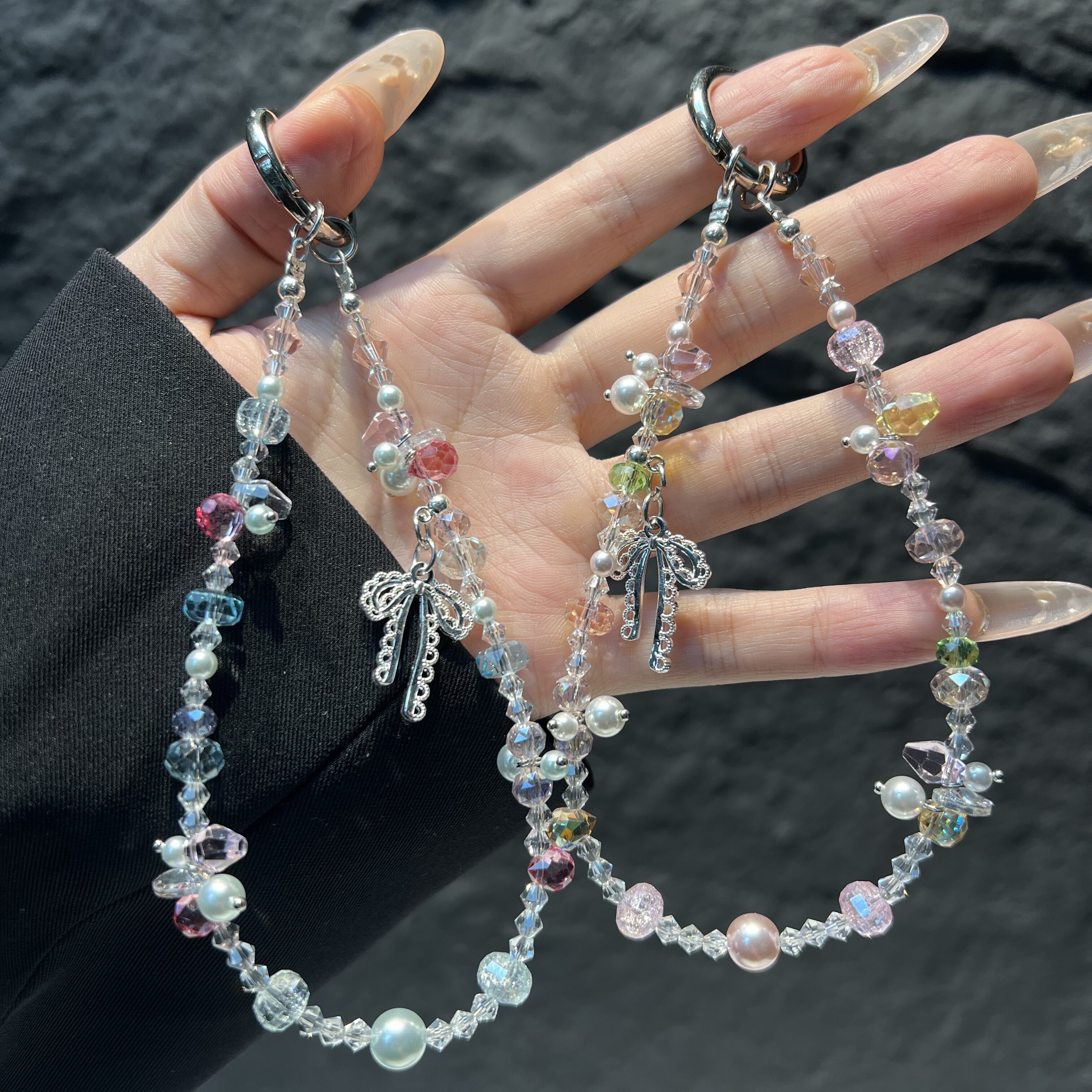 原创马卡龙碎彩水晶蝴蝶结手机链少女粉透珍珠串珠短款手腕挂绳手腕短款ins温柔风防丢手机挂饰挂链爆款