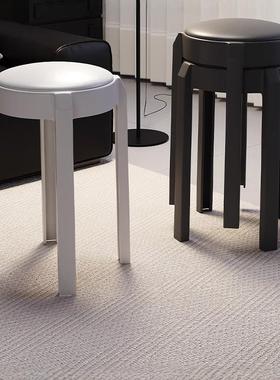 A minimalist and casual stool that can be stacked for easy s