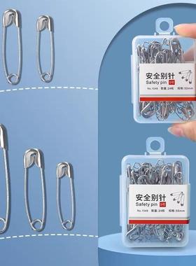 Old-style safety pins, clothing pins, small and large paper