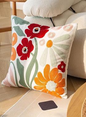 Floral throw pillow with daisy print, suitable for a rustic