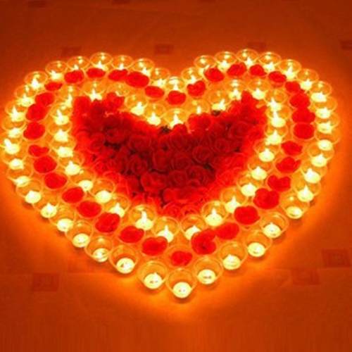 White candles, tea lights for Valentine's Day ambiance, smal
