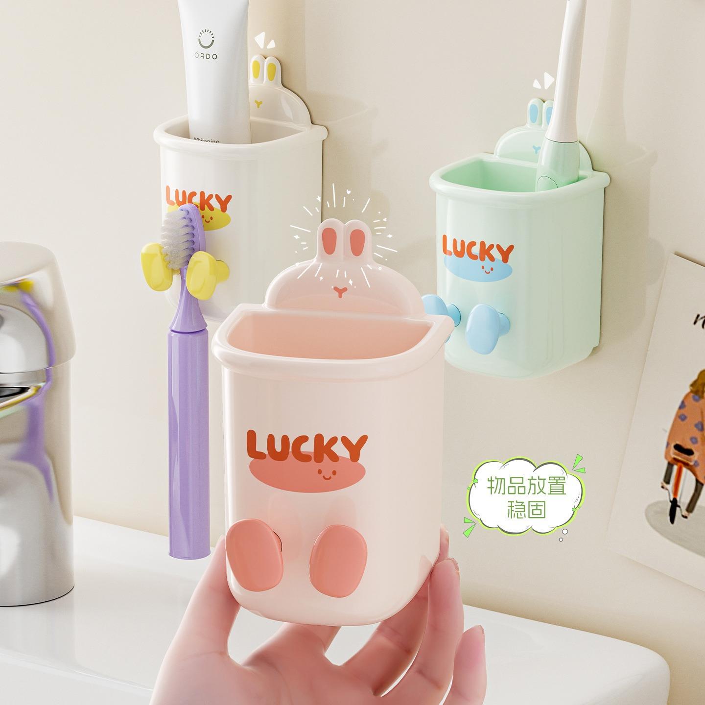 Wall-mounted bathroom organizer rack for toothbrushes, rinsi