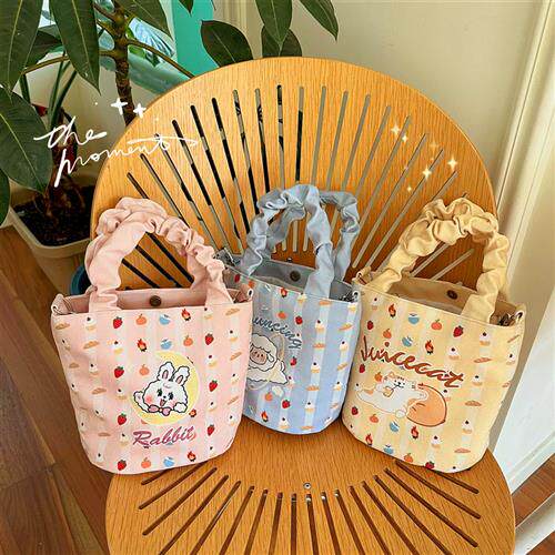 日系帆植绒帆布袋风慵懒猫咪学生手提水桶包上班族斜挎饭盒包