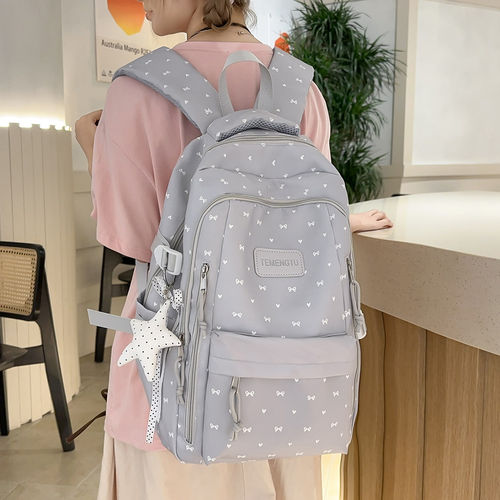 专柜正品少女风蝴蝶结印双肩背包女小学生大容量轻便书包女简约初