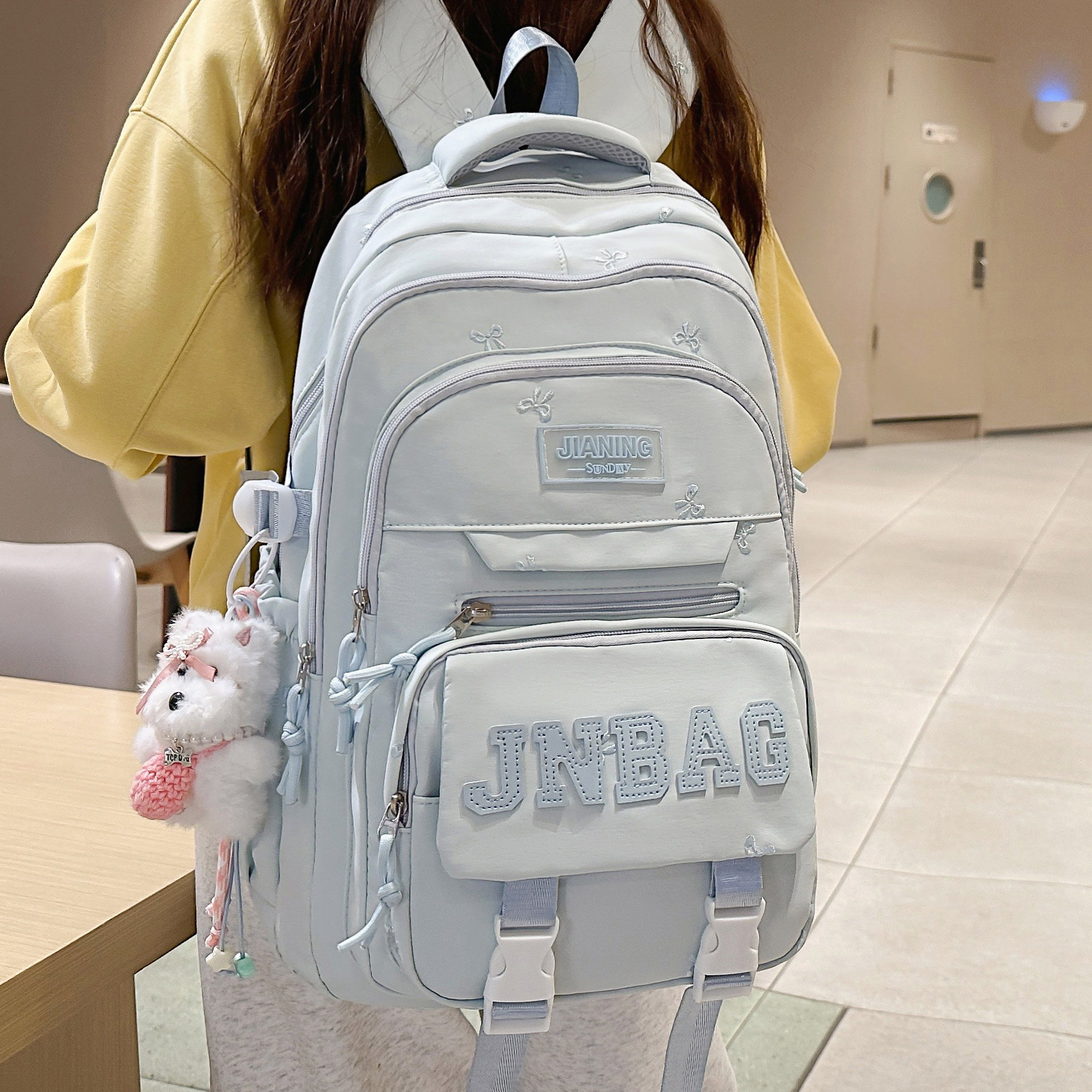 专柜正品可爱书包女韩版百搭纯色蝴蝶结刺绣双肩包初中高中大学生