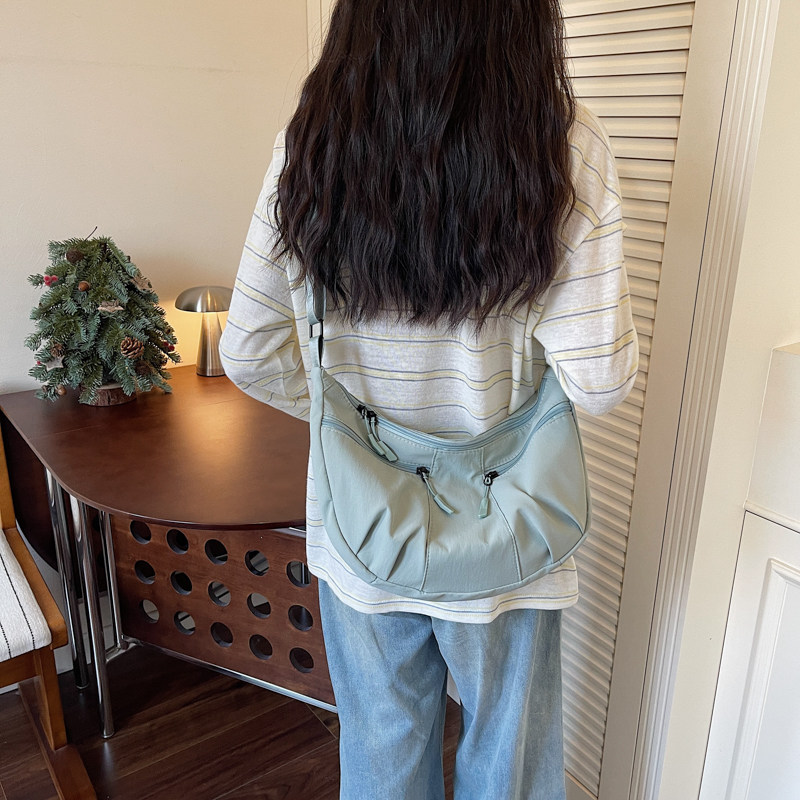 专柜正品2026帆布包女士款新款超火男士饺子包上班通勤大容量单肩