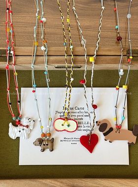 进口卡通陶瓷小狗串珠吊坠项链女多巴胺彩色长款可调节卫衣链百