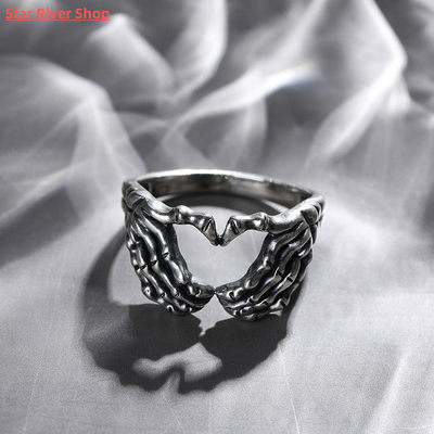 Retro skull hand with heart-shaped ring creative couple stai