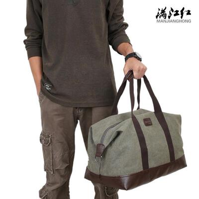 A man with a travel bag washes the tarpaulin and packs a bag