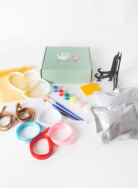 A babys footprint, babys footprint bag, handprints with a