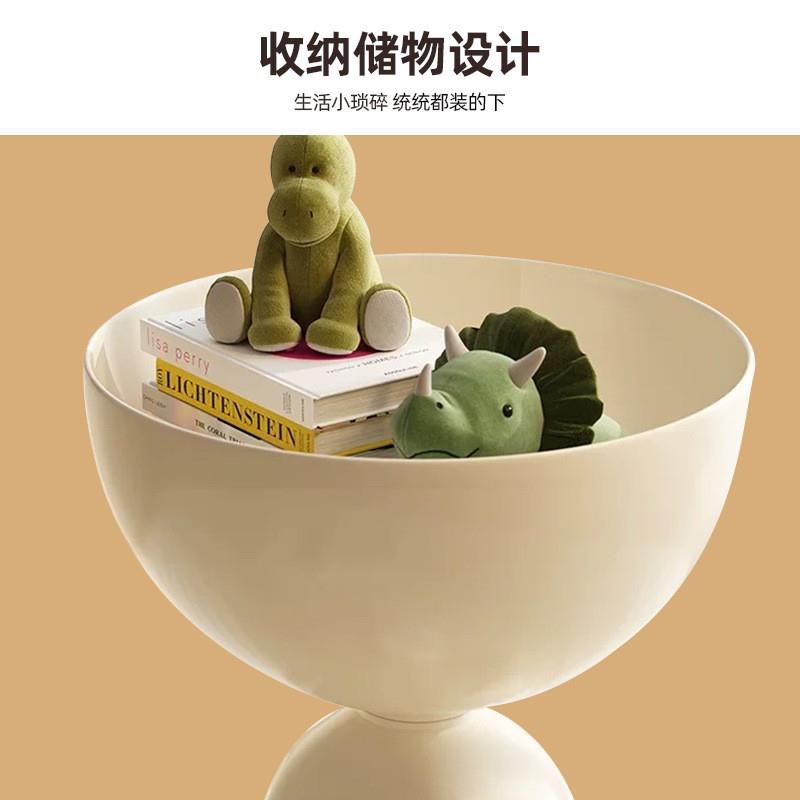 A light-loose bedside cabinet home with a couple of things o