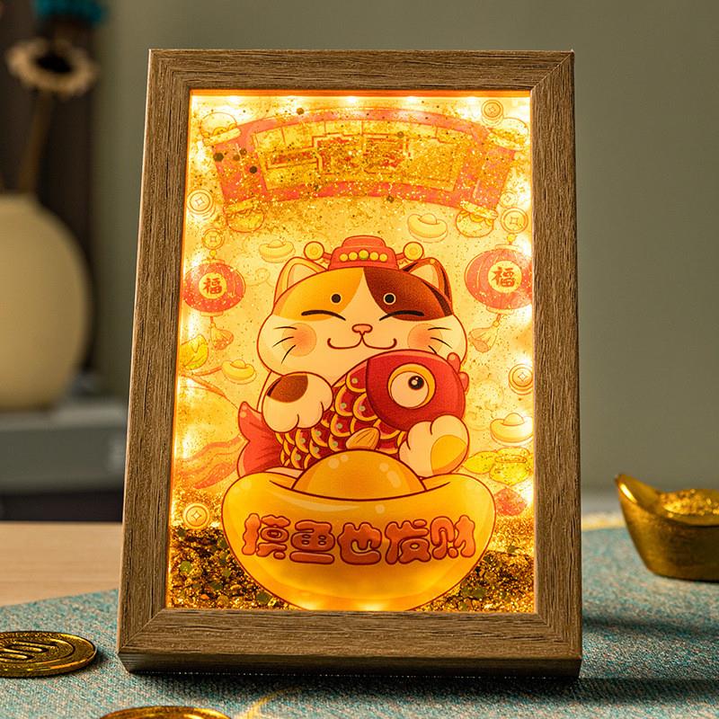 The Chinese treasure lord Kim Sha paints a picture frame wit