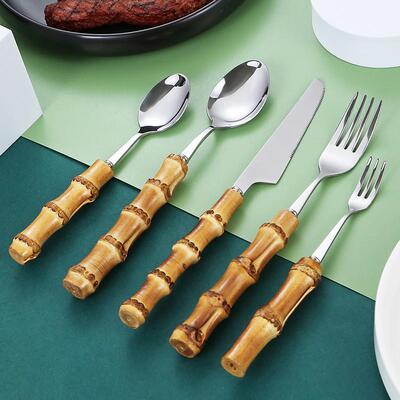 Its a natural bamboo handle set with a steak knife and a sp