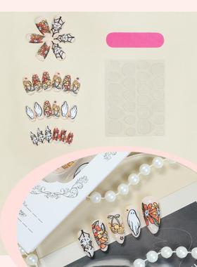 A picture of a pumpkin spider with a macaroni and a porcelai