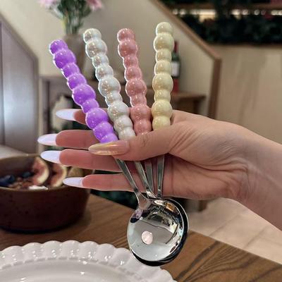 Stainless steel pearl handle spoon, ideal for home use as a