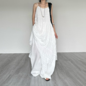 尢系UXI 文艺感植物染压皱提花不规则小众吊带旅拍仙气显瘦连衣裙