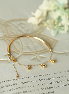 带定位珠自由滑动流苏手链包金