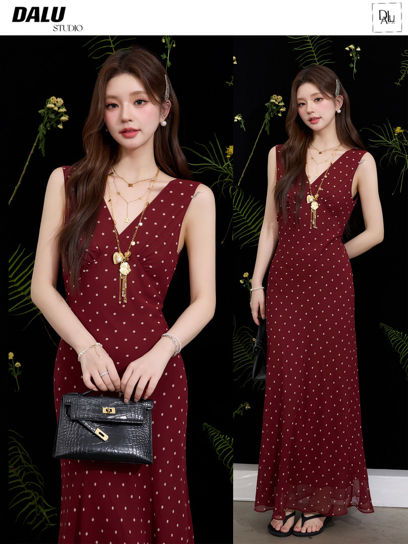 Burgundy polka dot sleeveless dress worn by a model