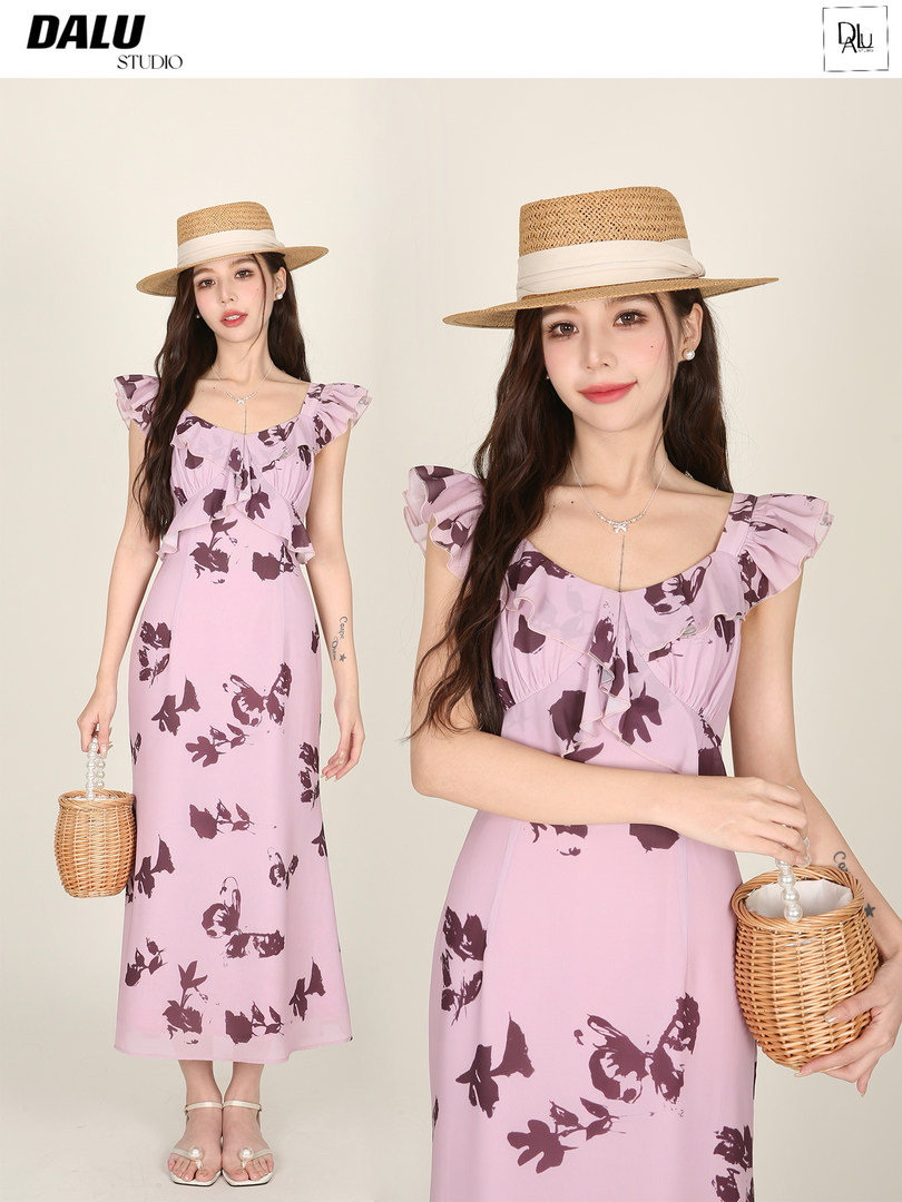 Pink floral midi dress worn by a model with a straw hat and woven bag