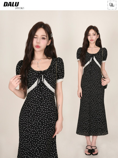 Black patterned midi dress worn by a model