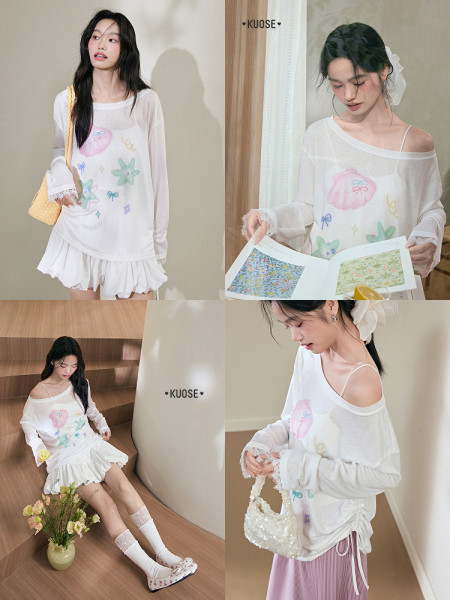 Model wearing a sheer white pastel-printed long-sleeve top with a short white skirt