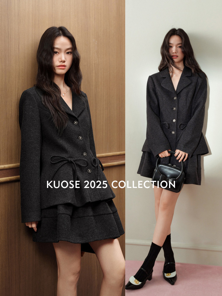 Black blazer and mini skirt outfit worn by a model in a fashion collection promo