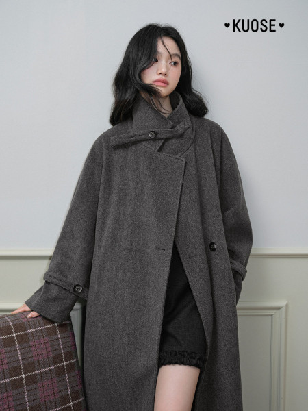 Model wearing a dark gray oversized wool coat