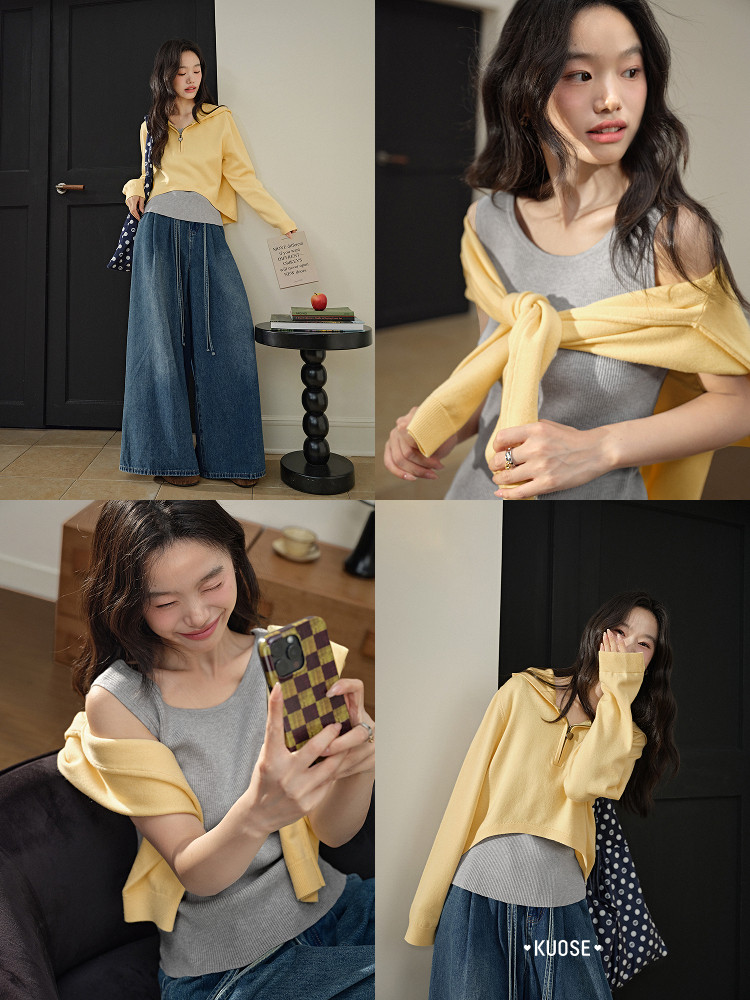Model wearing a yellow cropped sweater over a gray tank top with wide-leg jeans