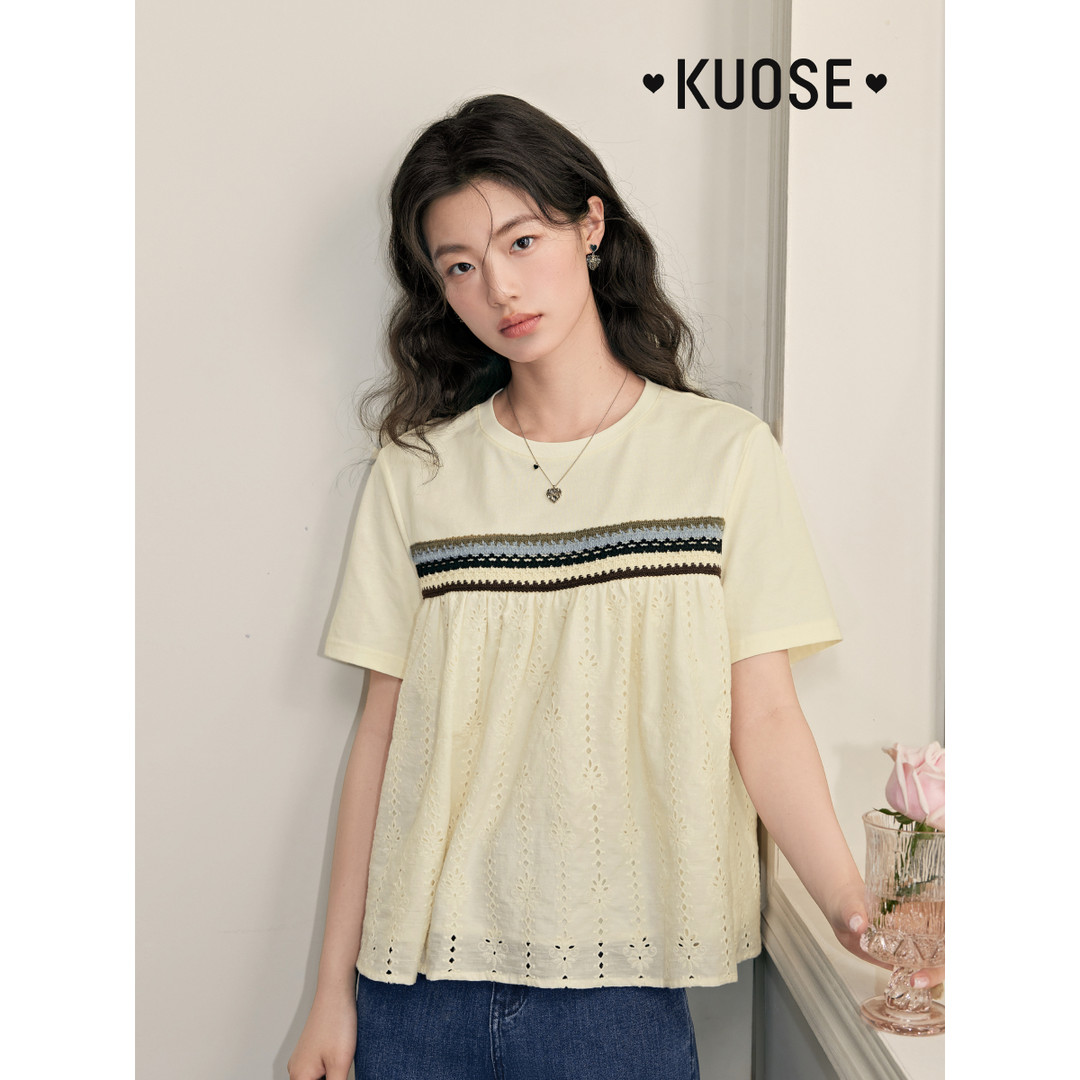Light yellow short-sleeve lace-panel top worn by a model