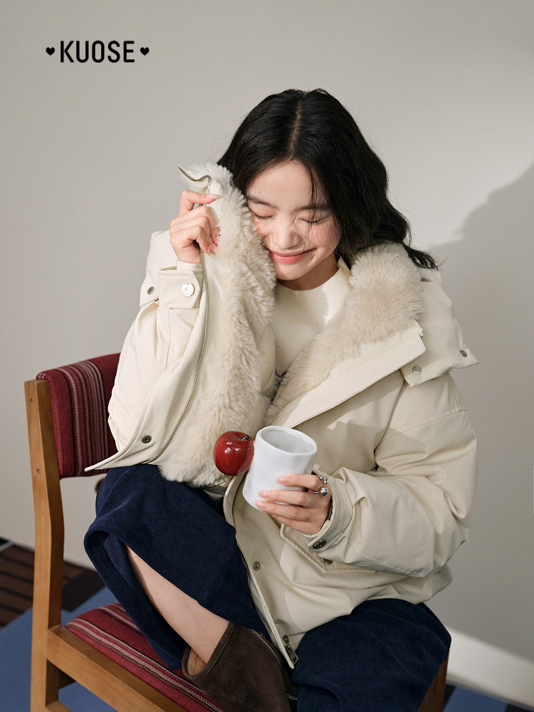 Woman wearing a cream faux-fur lined winter jacket