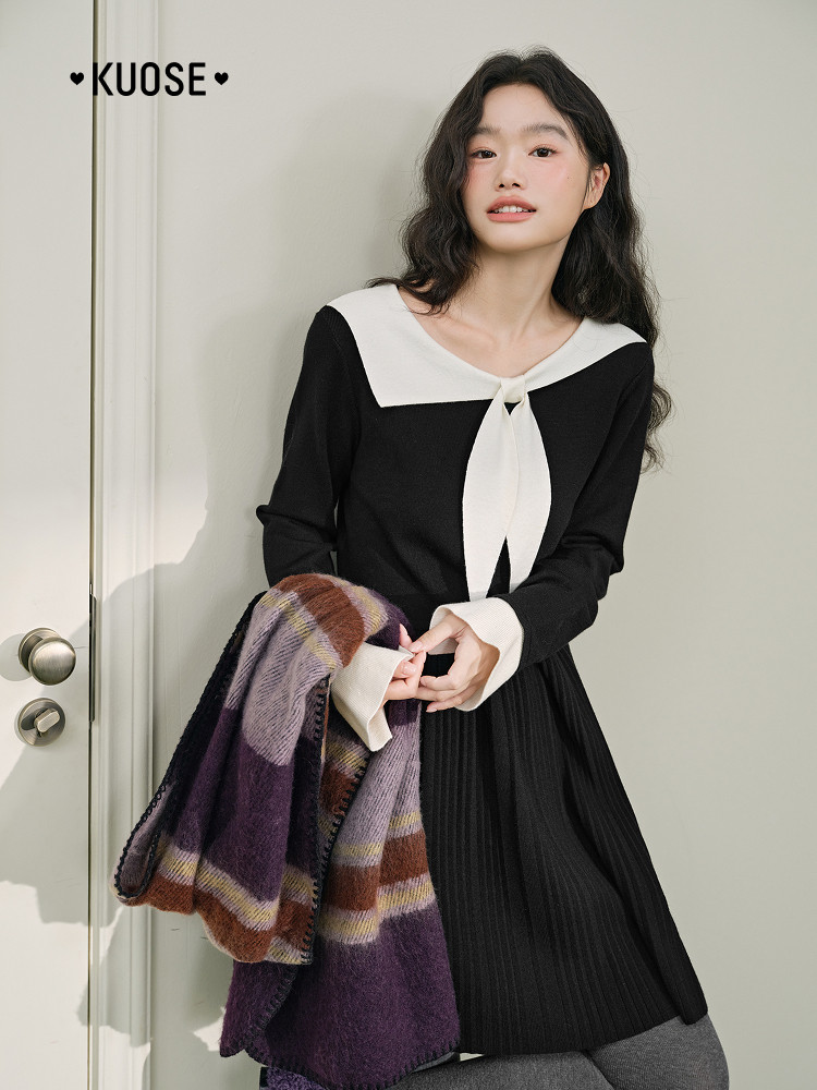Black and white long-sleeve dress worn by a model