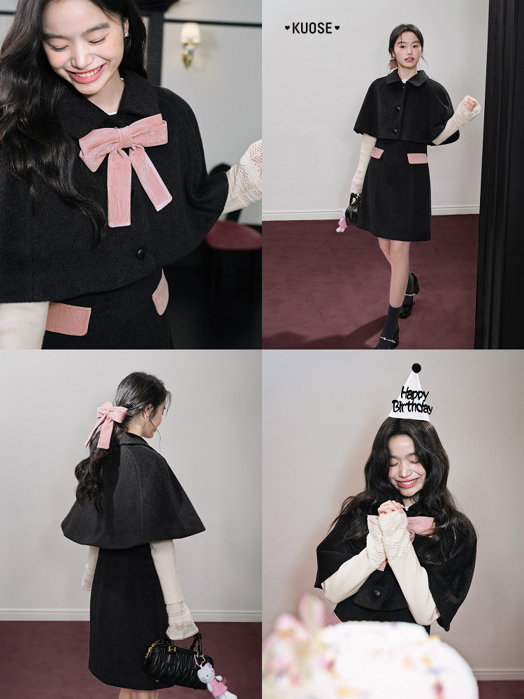 Black cape-style dress with pink bow accents worn by a model