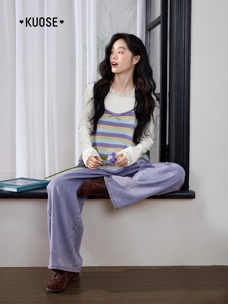 Model wearing a pastel striped layered top with loose lavender jeans