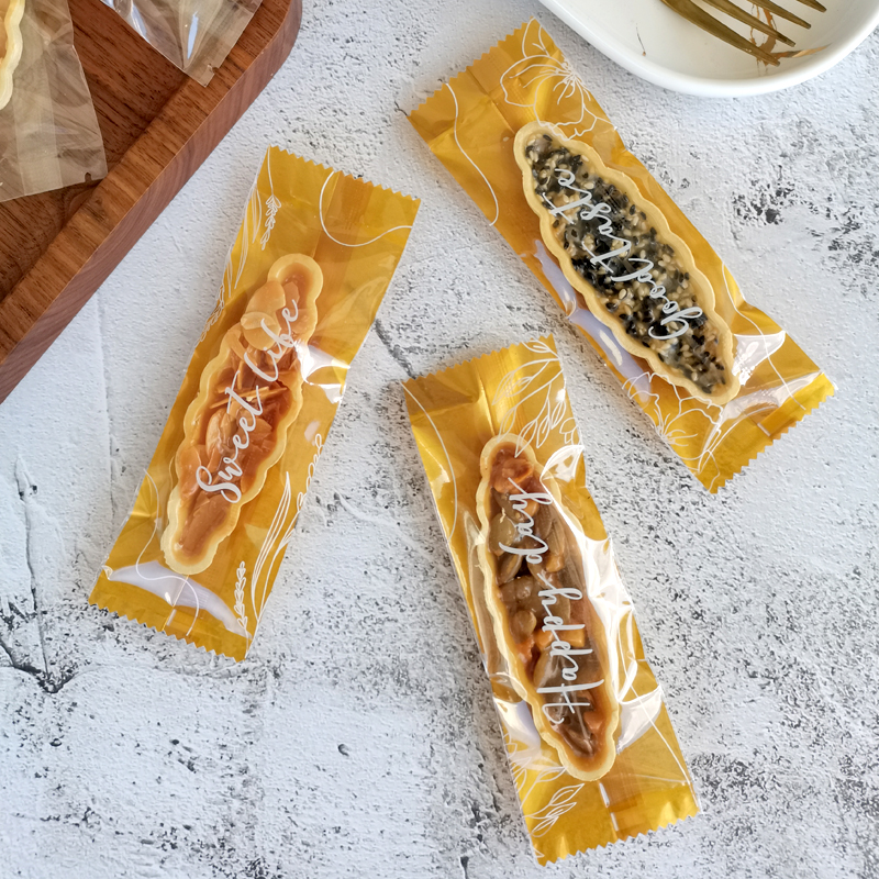 网红焦糖糯米船包装袋杏仁坚果酥脆长形饼干牛轧棒棒糖机封包装盒