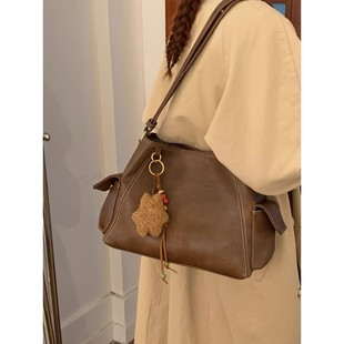 MK DA女包2025新款复古真皮大容量水桶包小众设计通勤单肩斜挎包