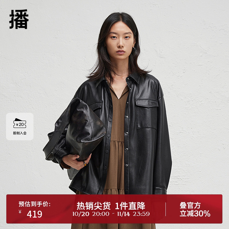 前短后长微开衩下摆，.袖口一粒扣点缀