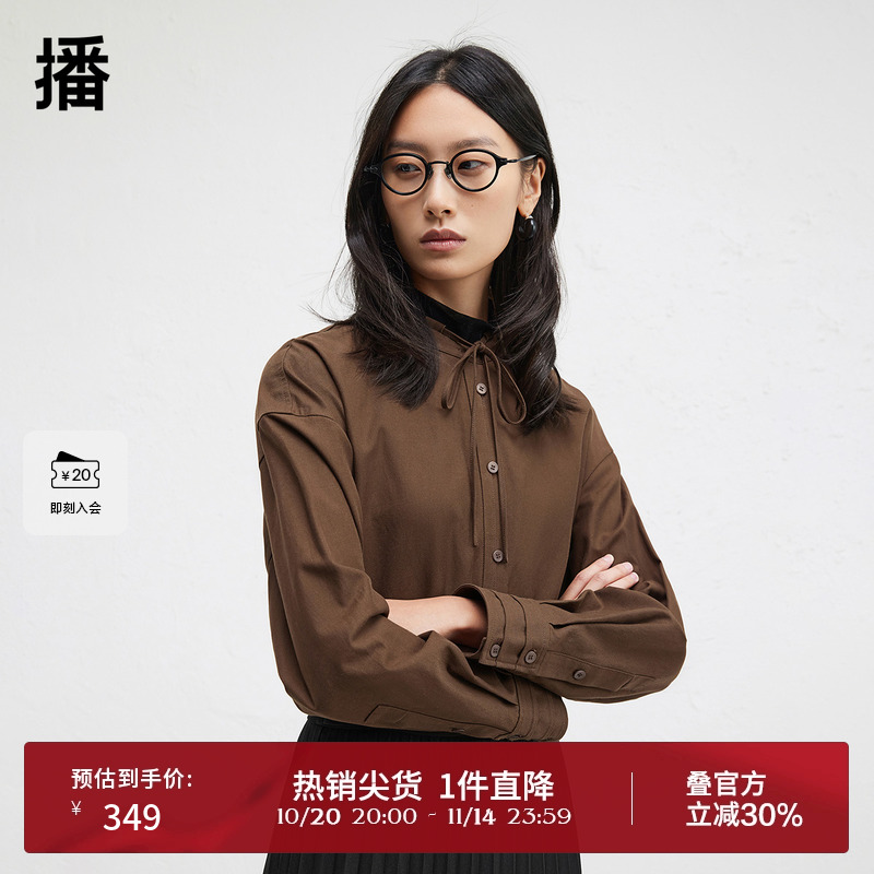 时髦串绳立领，袖口三层压褶设计