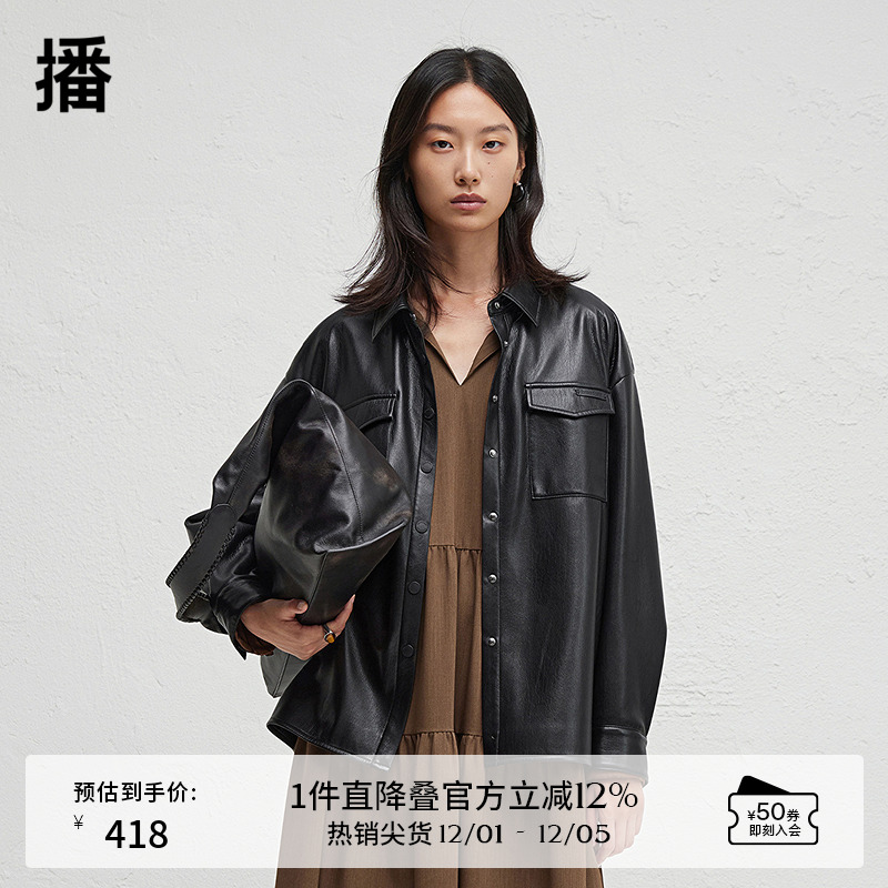 前短后长微开衩下摆，.袖口一粒扣点缀