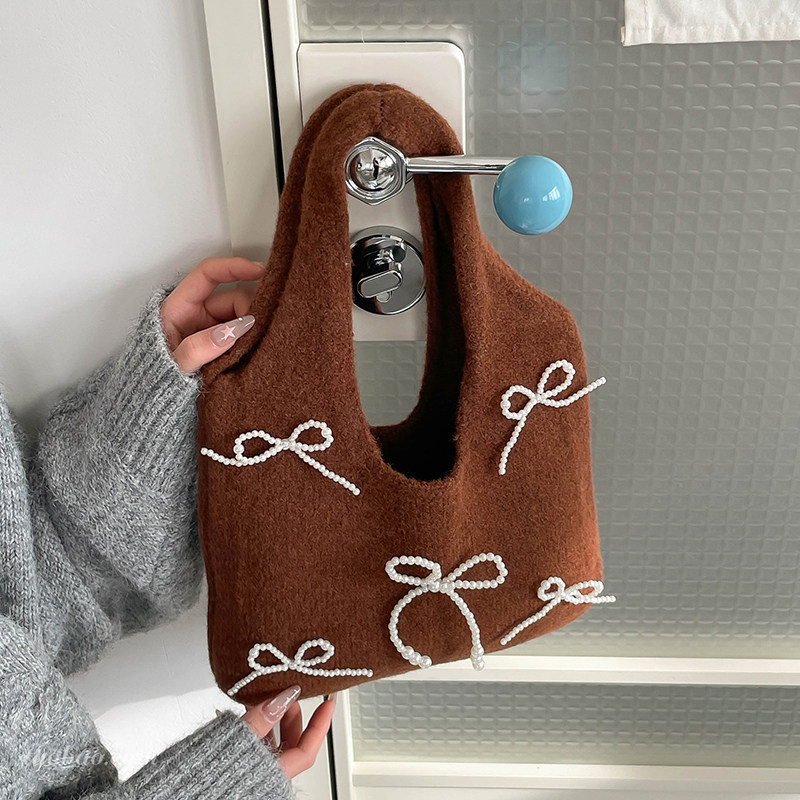 独特小众蝴蝶结毛呢包包女2025新款精致超火手提水桶包外出小拎包,箱包皮具/热销女包/男包,托特包,淘宝优惠券,粉丝福利购,淘宝优惠卷