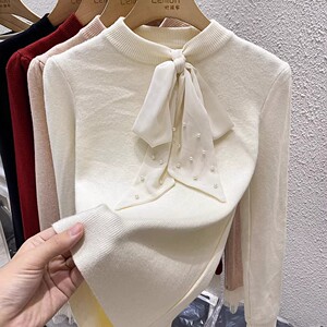 2023秋冬法式针织衫女修身设计感小众蝴蝶结毛衣洋气内搭打底上衣