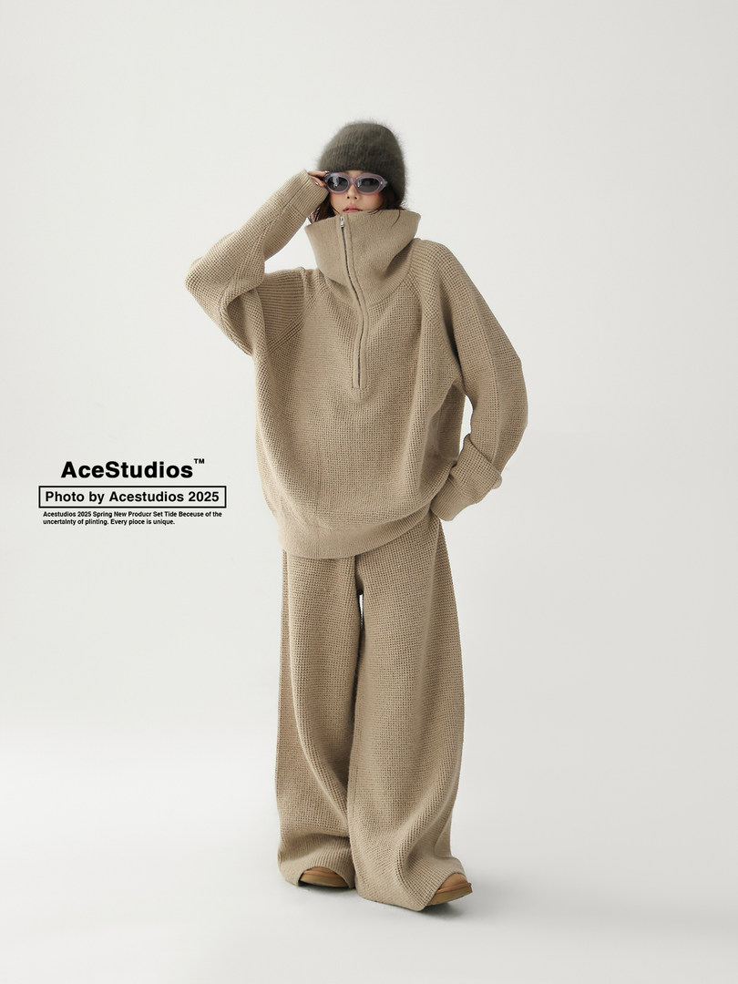 Beige knit oversized sweater and wide-leg pants set worn by a model