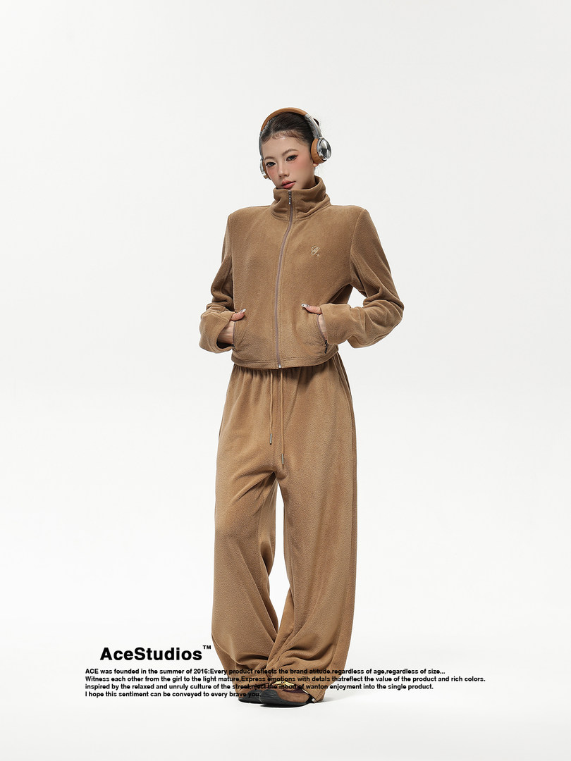 Model wearing a brown fleece zip-up jacket and matching wide-leg pants set
