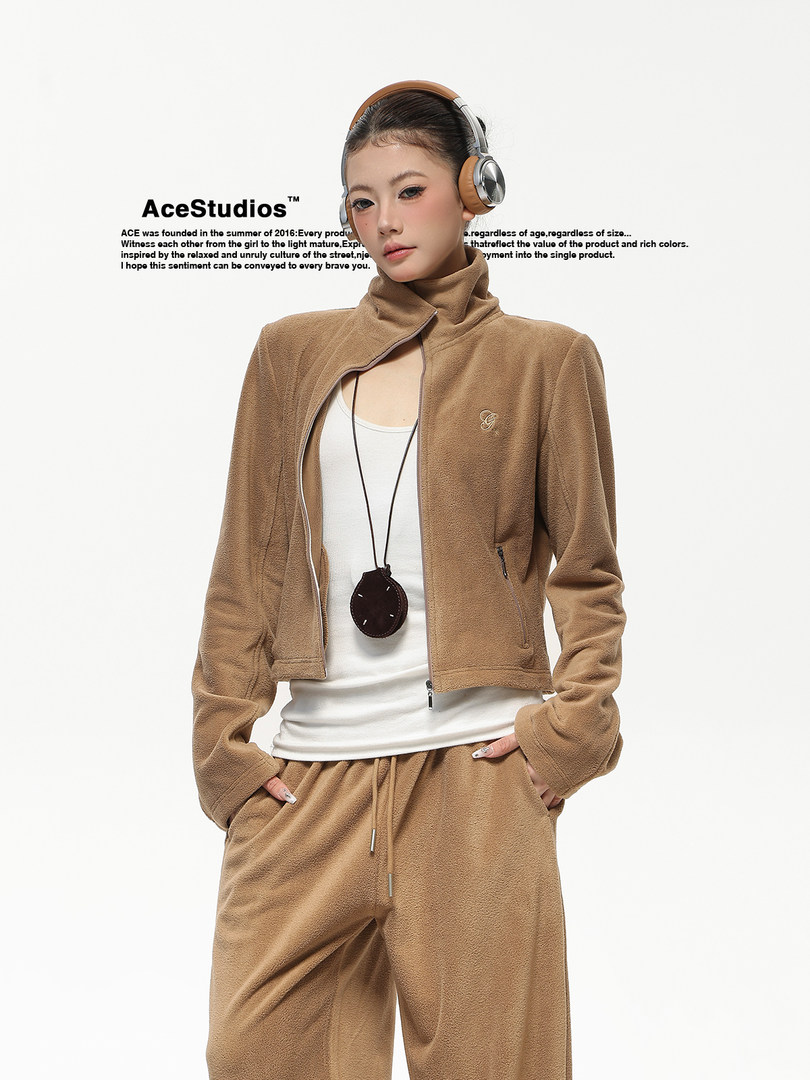 Model wearing a brown fleece zip-up jacket and matching pants