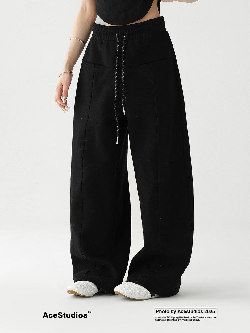 Black wide-leg pants worn by a model