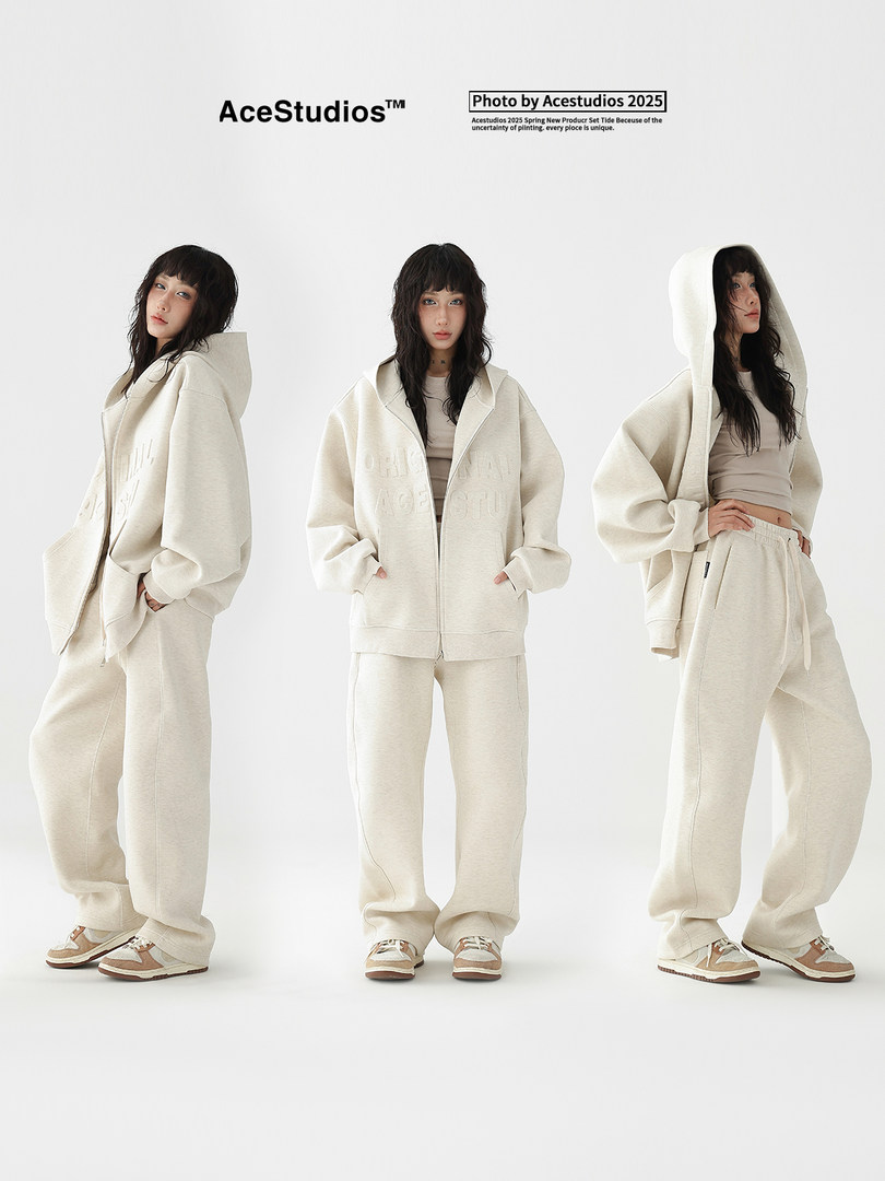 Cream oversized hoodie and sweatpants set worn by a model on a white background