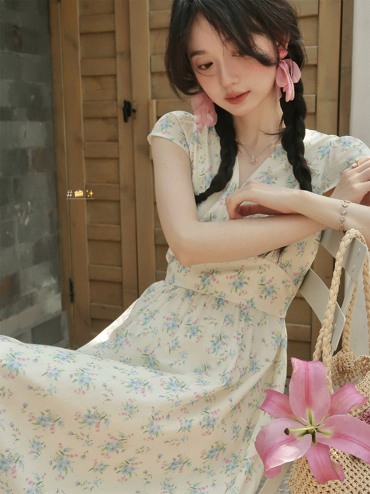 Woman wearing a light floral midi dress