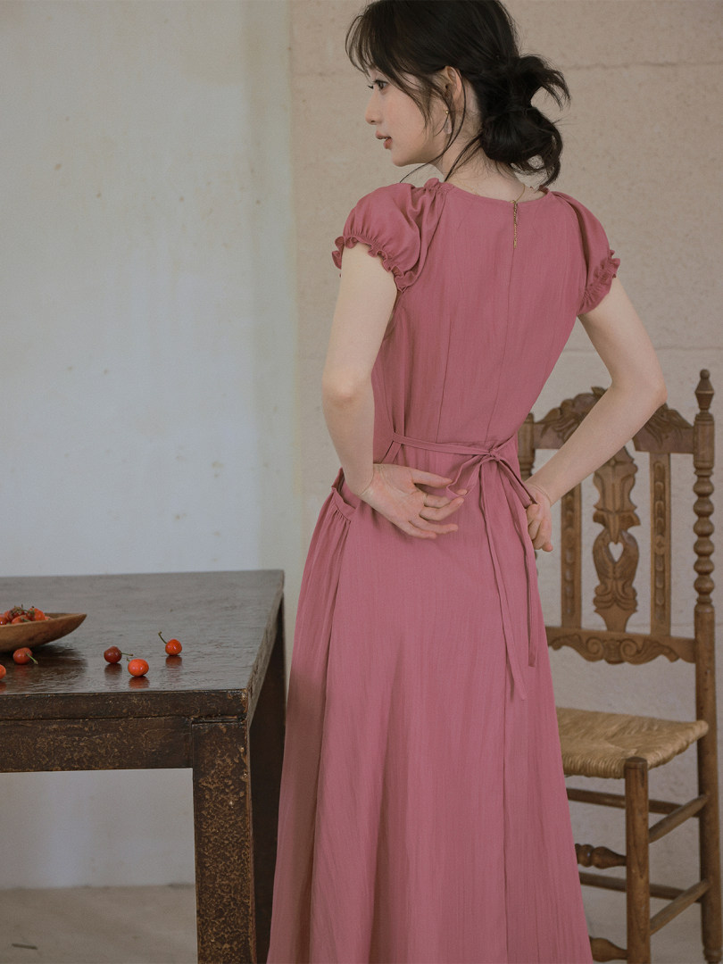 Pink short-sleeve dress worn by a model