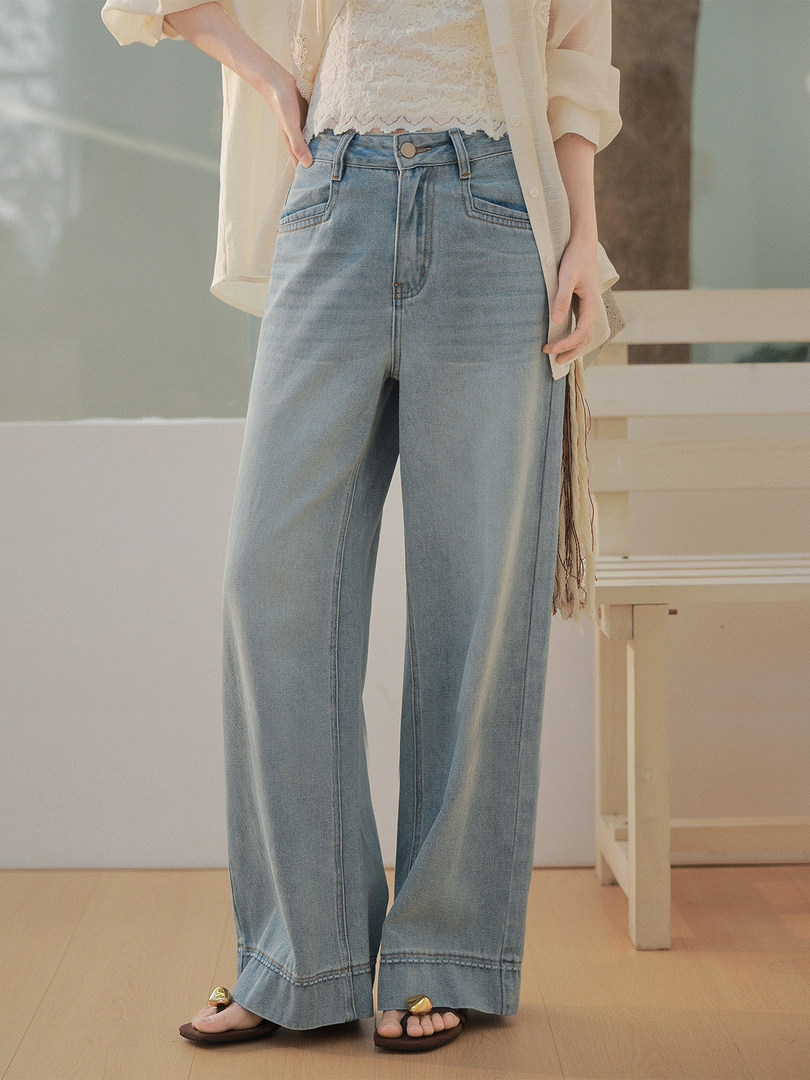 Light wash wide-leg jeans worn by a model